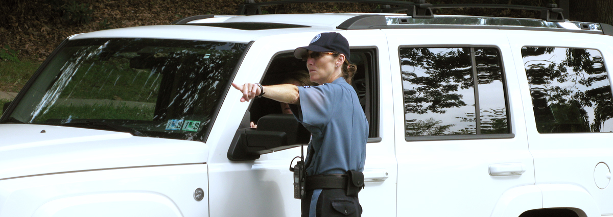 A Cabrini Public Safety Officer, giving a driver directions