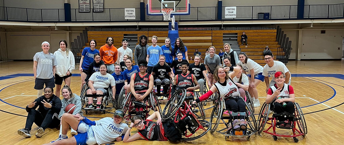 Students play wheel chair basketball