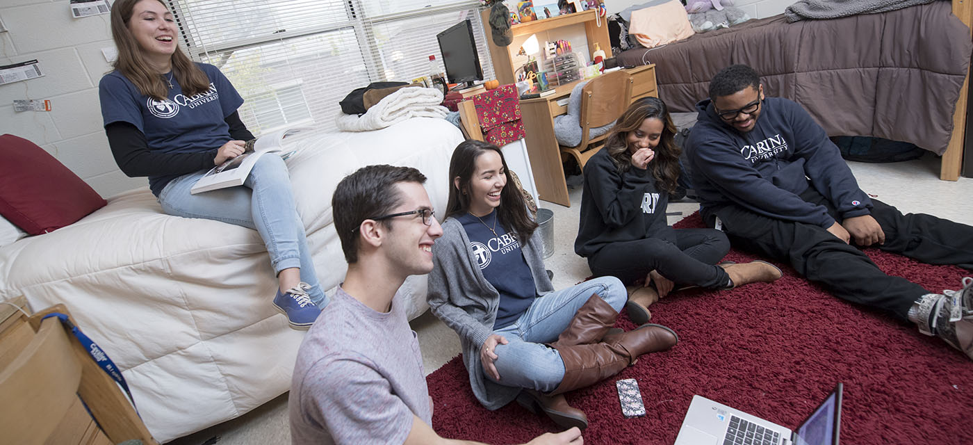 students hanging out in dorm room