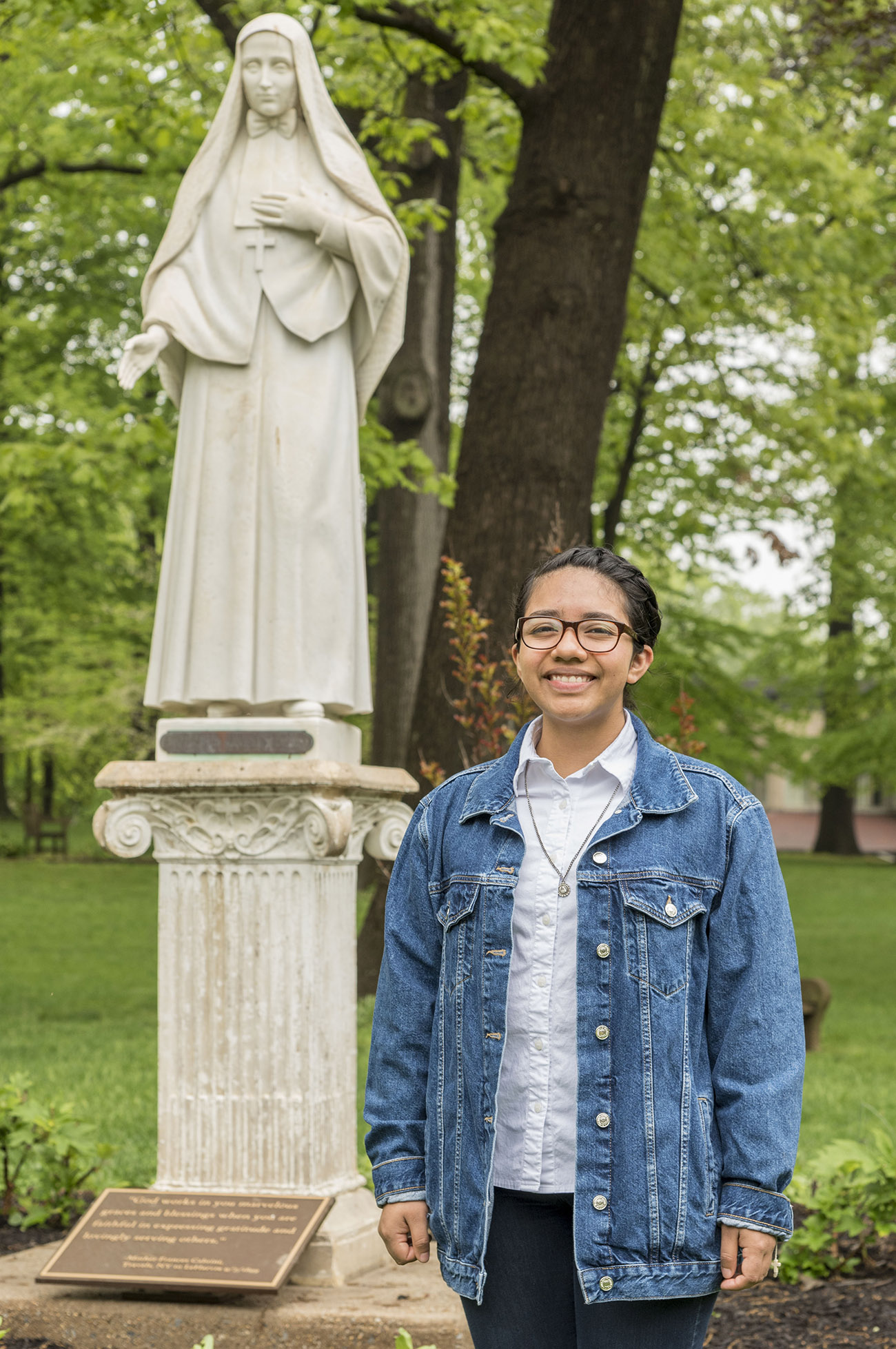 Bianca standing with Mother Cabrini Statue