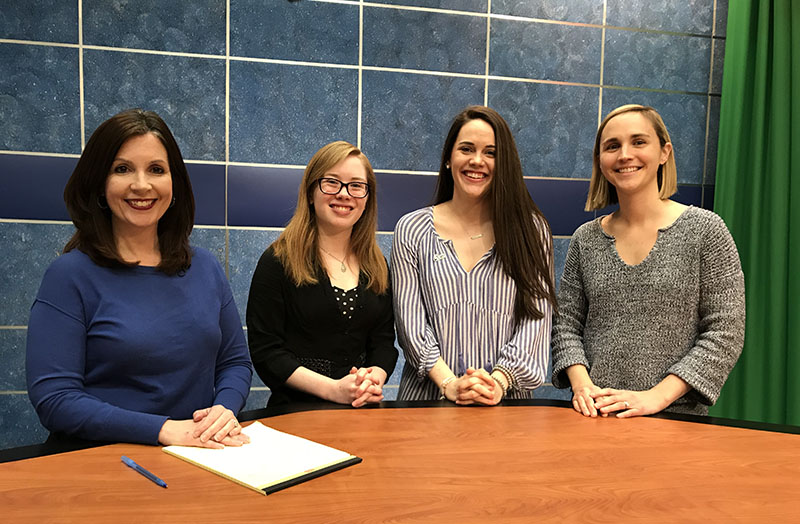 Megan Gilbert, Katie Briante, Molly Seaman, and Melissa Stevens at the news desk