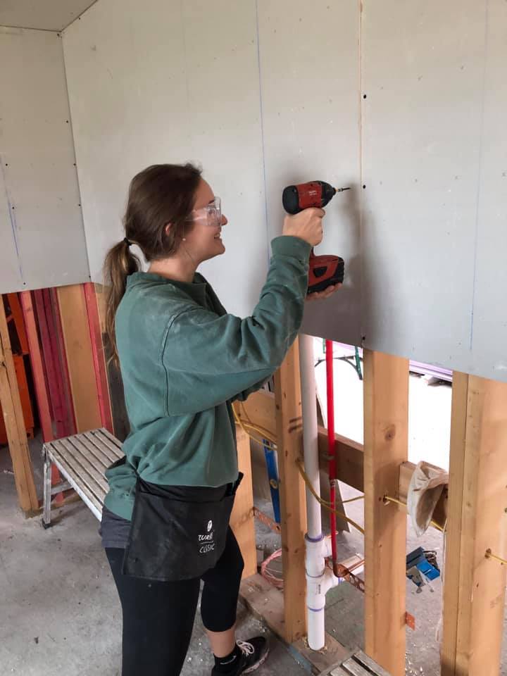 Alumna Jill Nawoyski helping to build a house