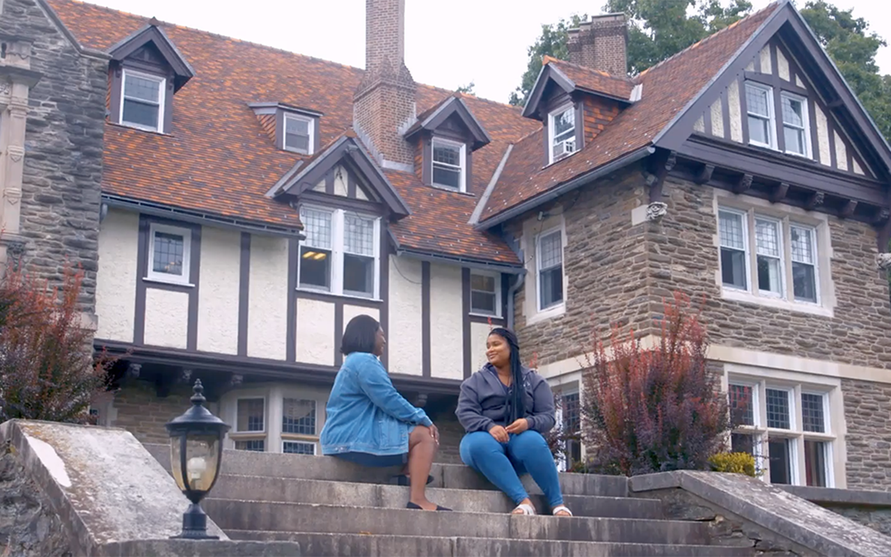 Tianna Williamson and Latia Hayes talk outside the Mansion